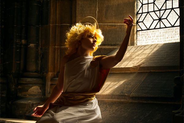 Dramatic portrait titled Apollo by HN1 Photography student Nath Kossak, featuring a figure in golden light inside a cathedral setting, winner of the Advanced Photography category at Craftex 2025.
