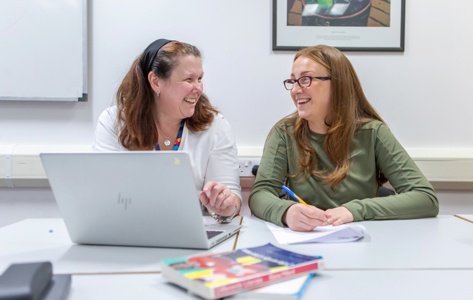A joyful interaction captured between a Glasgow Kelvin College lecturer and student, emphasising the positive, welcoming learning environment.