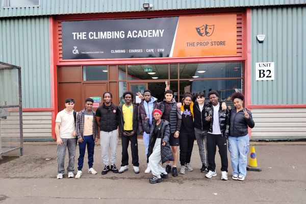 ESOL students gathered outside the Climbing Academy before taking part in climbing activities.