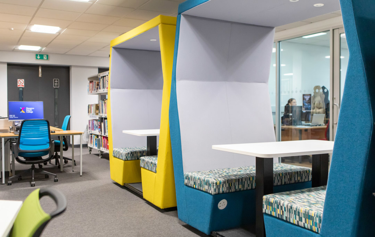 Colourful study pods and computer workstations in the Library and Flexible Learning Centre at Glasgow Kelvin College’s Easterhouse campus.
