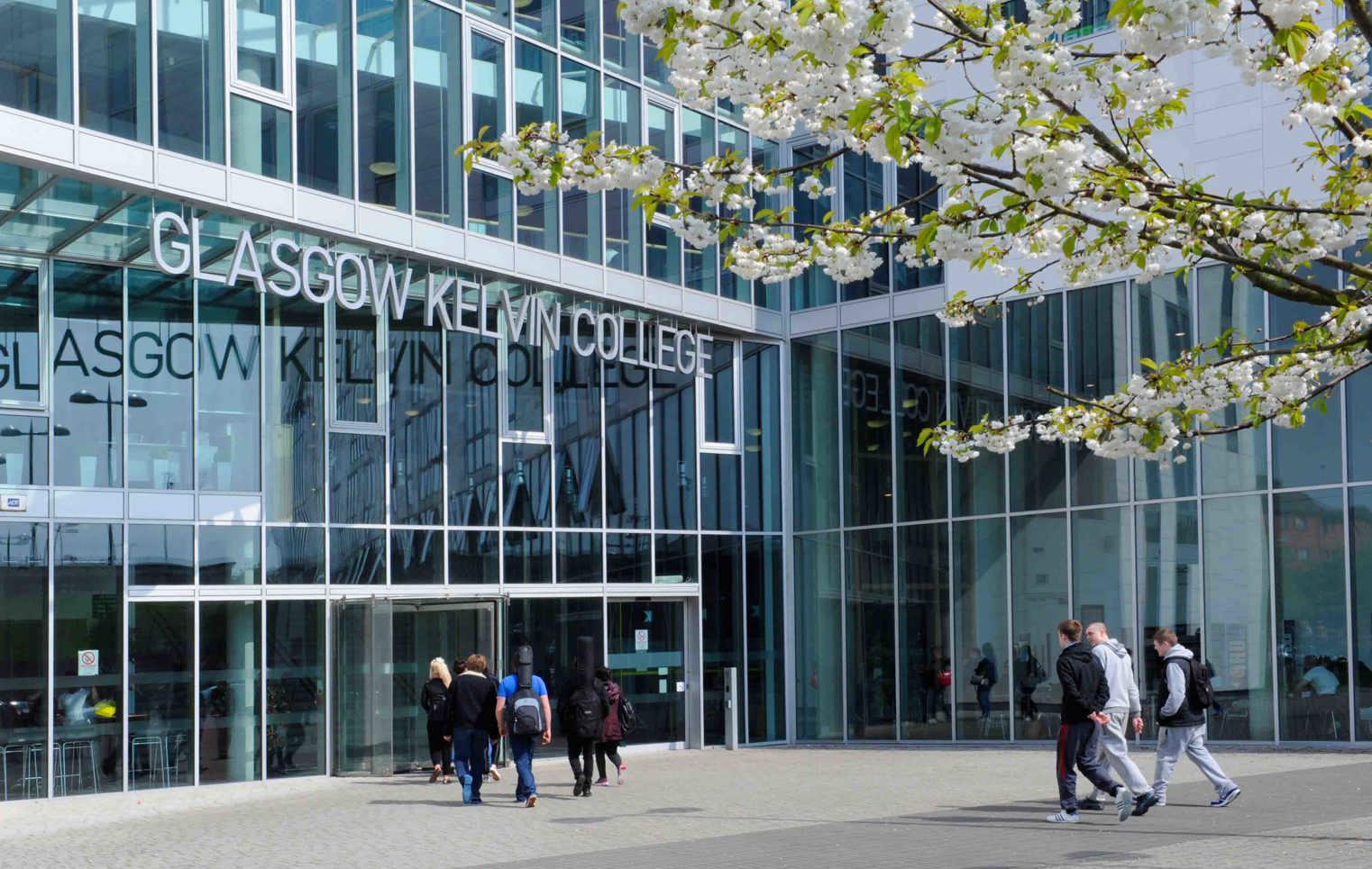 Front view of Glasgow Kelvin College Springburn Campus, featuring the main entrance, glass façade, and campus signage.