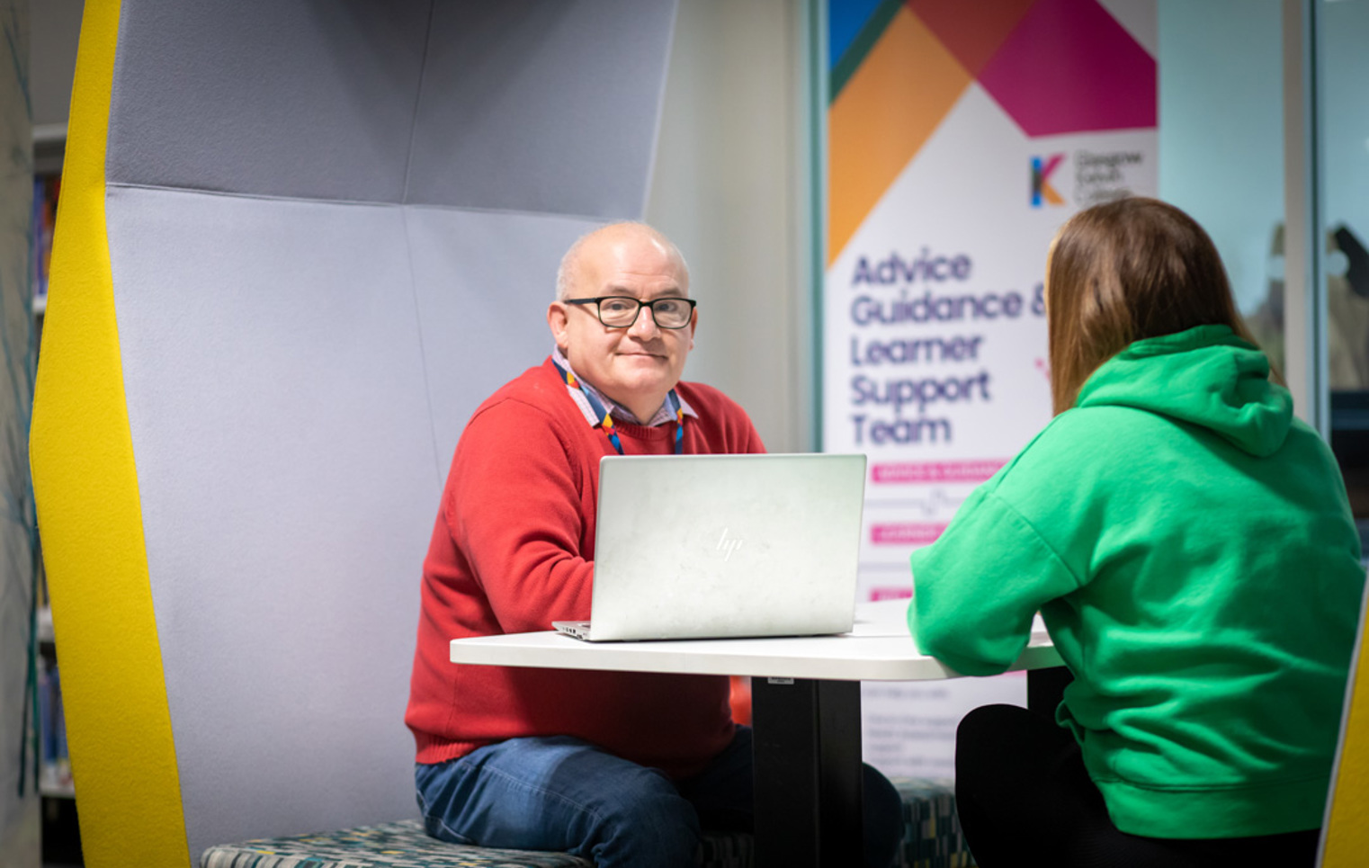 Advice and Guidance team member meeting with a student in a study pod at Glasgow Kelvin College’s Springburn campus.