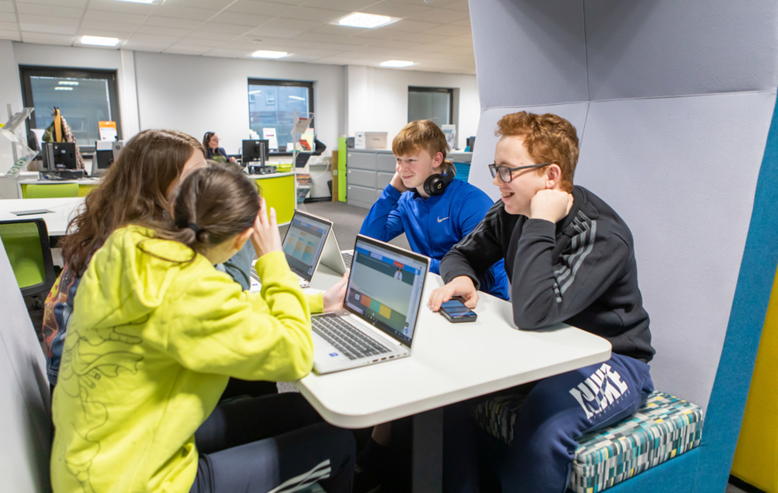 Group of students working together on laptops in the Flexible Learning Centre at Glasgow Kelvin College’s Easterhouse campus.
