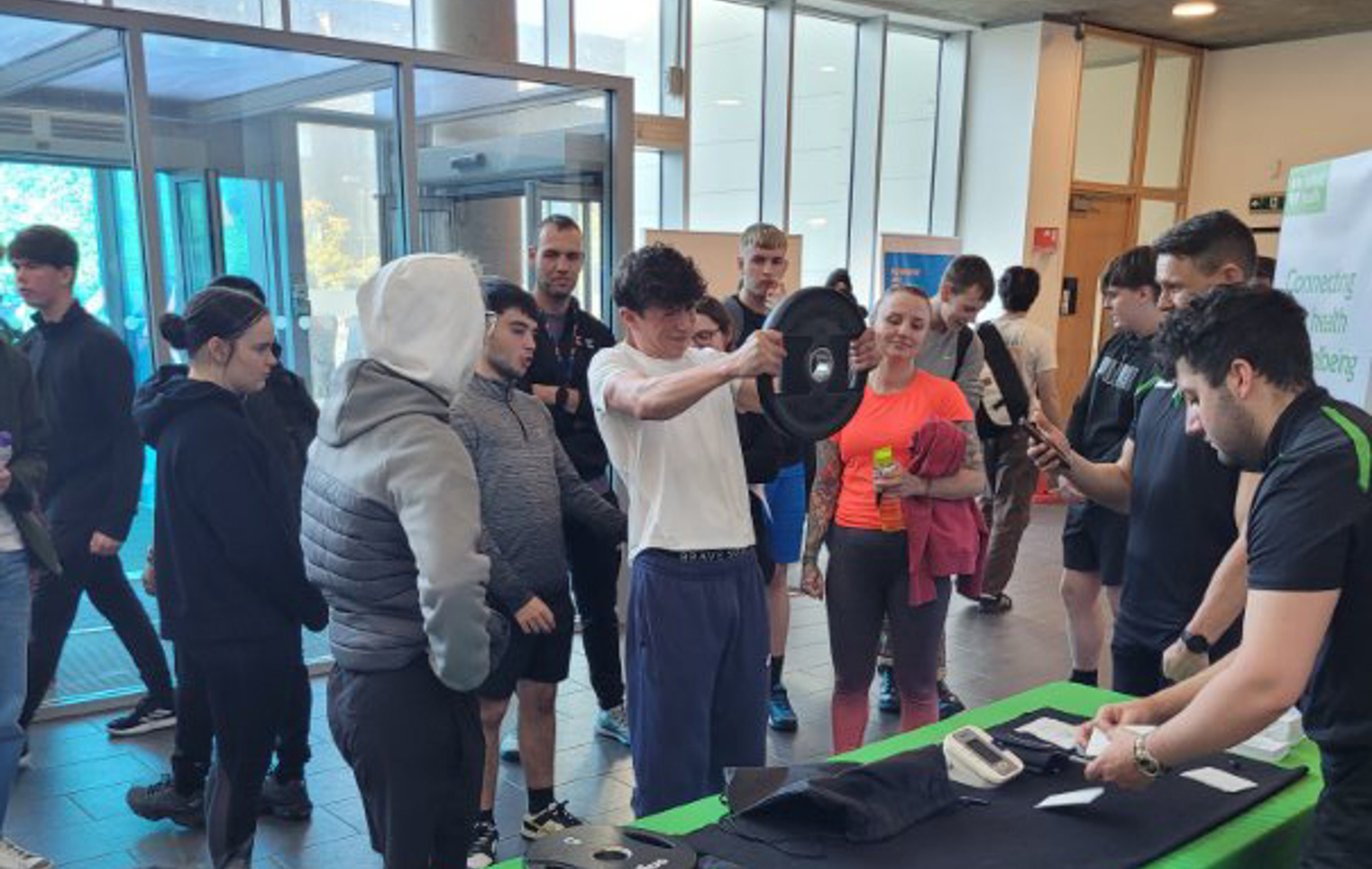 Students at Glasgow Kelvin College gathered in the campus atrium, taking part in a weightlifting challenge and interactive stall for National Fitness Day.