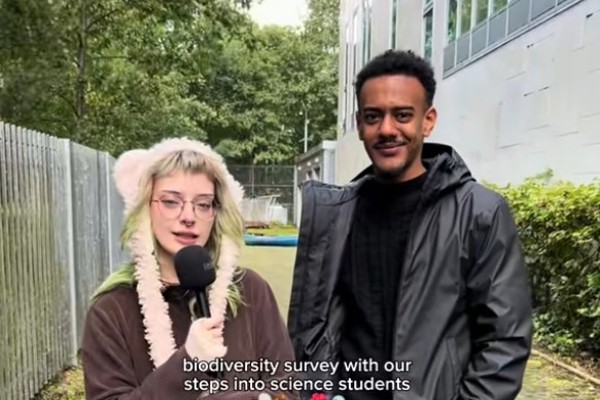 Steps into Science students taking part in a biodiversity survey on campus, collecting and discussing environmental data.