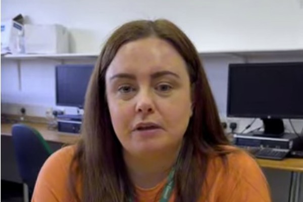Helen, PDA Childhood Practice student, speaking into a microphone during an interview at Glasgow Kelvin College.