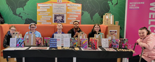 Students from Skills for Learning, Life and Work 2 showcasing recycled notebook project at Glasgow Goes Green event